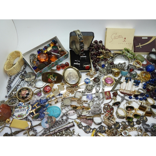 888 - A collection of vintage costume jewellery to include Russian examples, retro cufflinks tie slides, b... 