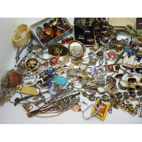 888 - A collection of vintage costume jewellery to include Russian examples, retro cufflinks tie slides, b... 