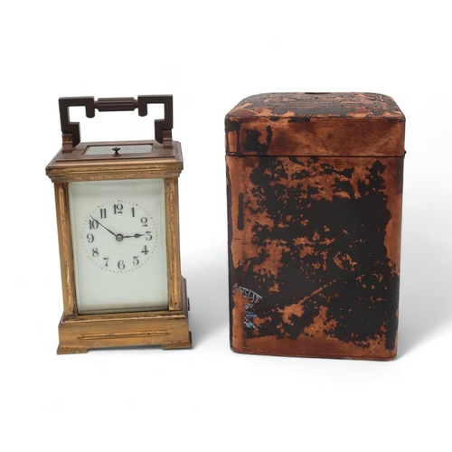 194 - A brass and glass repeating carriage clock