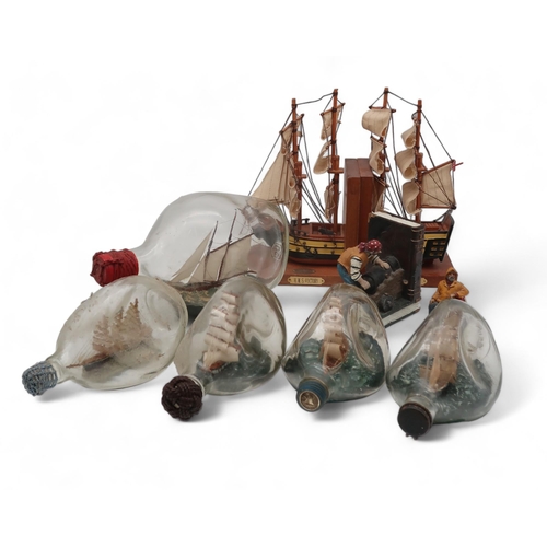 195 - A collection of ships in bottles, a pair of ship bookends etc