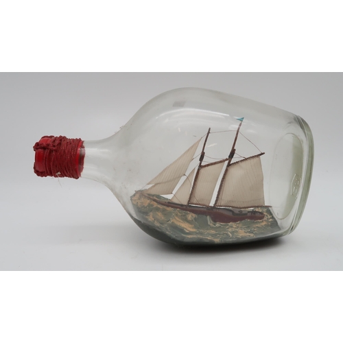 195 - A collection of ships in bottles, a pair of ship bookends etc