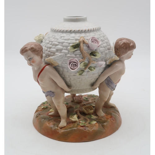 196 - A Meissen style cherub vase