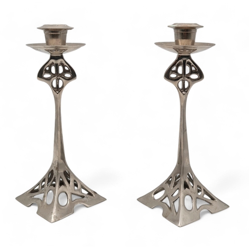 198 - A pair of Arts and Crafts style candlesticks