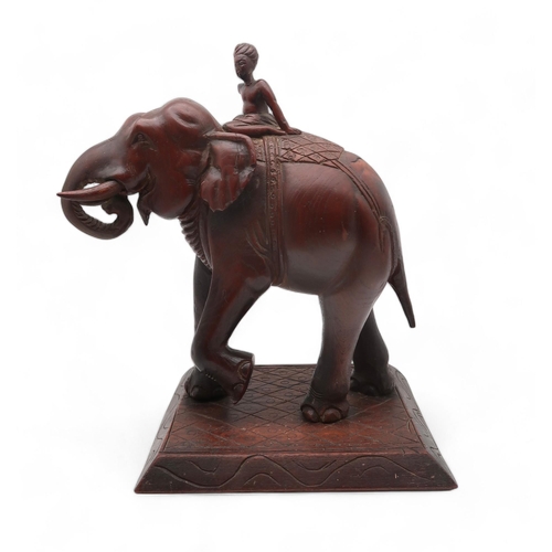 201 - A carved wooden elephant and rider