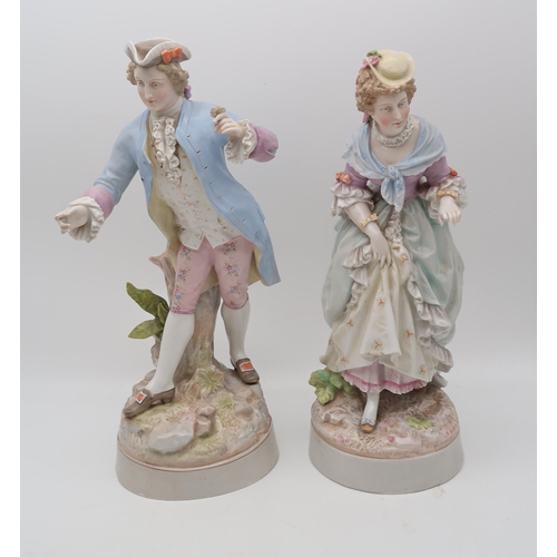 209 - A pair of Meissen style figures in 18th century dress, together with two other figures