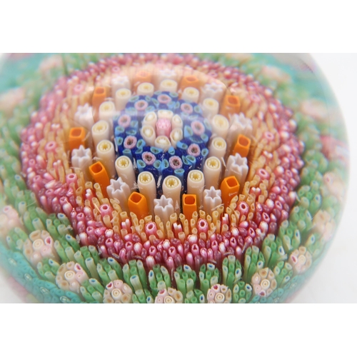 213 - A Baccarat millefiori cane paperweight, dated 1968