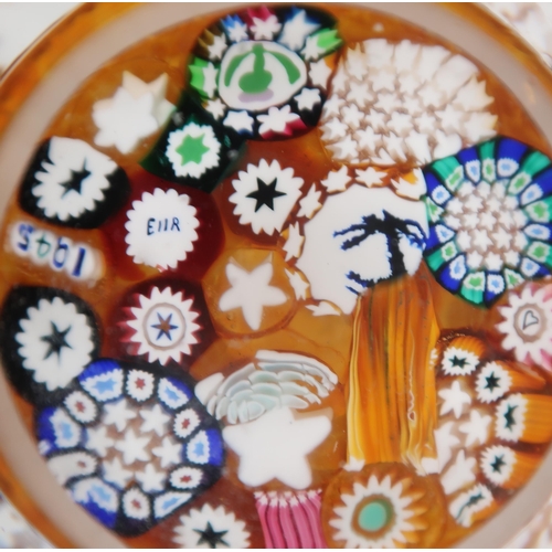 215 - A collection of John Deacons millefiori paperweights one dated 2011, two with EIIR cane, two with St... 