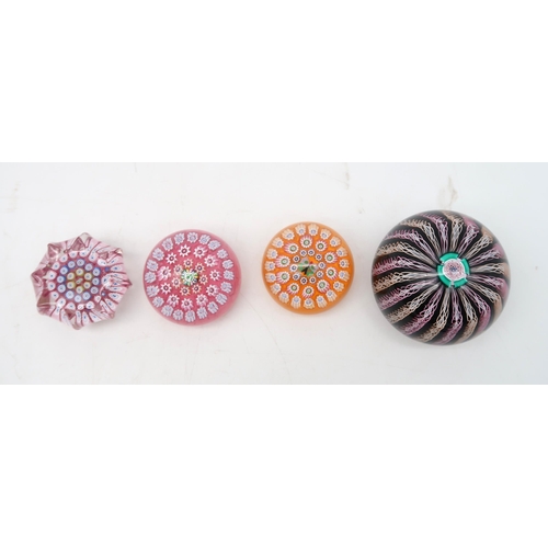 215 - A collection of John Deacons millefiori paperweights one dated 2011, two with EIIR cane, two with St... 