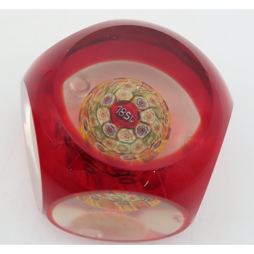 219 - A millefiori paperweight dated 1854, possibly Baccarat, together with another paperweight also dated... 