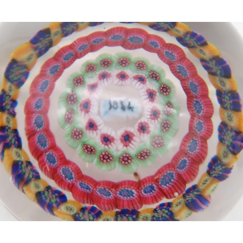 219 - A millefiori paperweight dated 1854, possibly Baccarat, together with another paperweight also dated... 