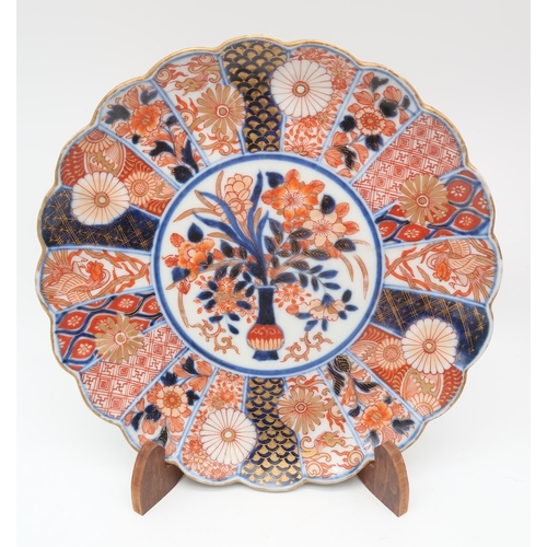 224 - A large collection of Imari vases, plates and chargers, figures, a magnifying glass etc