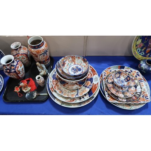 224 - A large collection of Imari vases, plates and chargers, figures, a magnifying glass etc