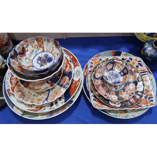 224 - A large collection of Imari vases, plates and chargers, figures, a magnifying glass etc