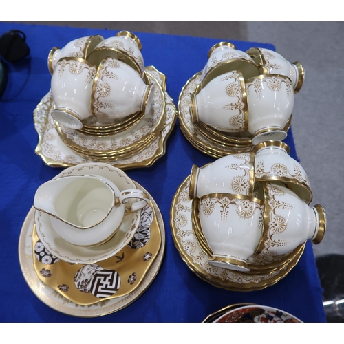 233 - A Plant Tuscan china tea set, the cream ground with gilt and brown decoration