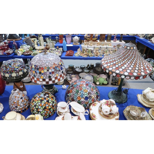 238 - A collection of stained and leaded glass lamp shades, some with bases