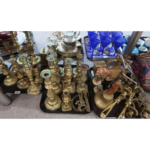 273 - A collection of brass candlesticks including bullseye good luck examples, Diamond princess and other... 