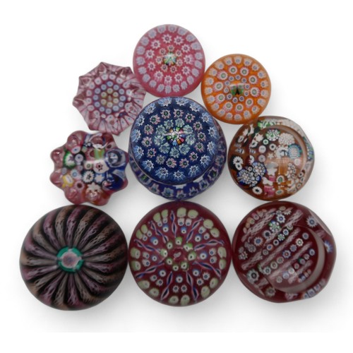 215 - A collection of John Deacons millefiori paperweights one dated 2011, two with EIIR cane, two with St... 