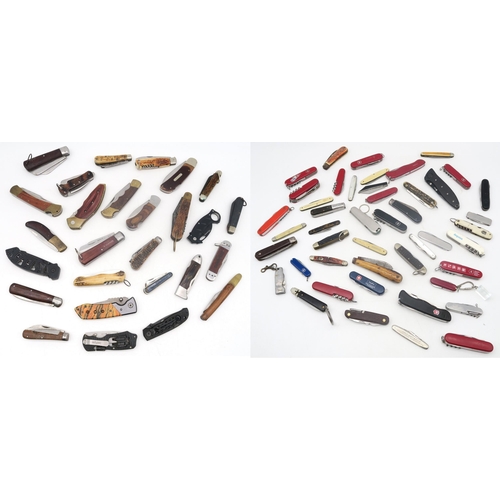 473 - A large collection of folding/penknives, to include examples by Lakota, Buck, Victorinox, Wynn's, Sc... 