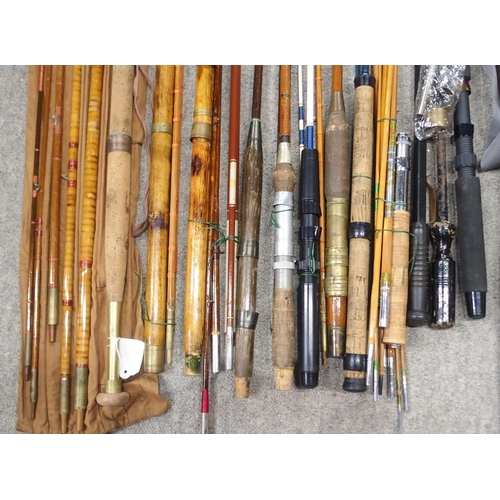 482 - A collection of fishing rods, including an S.Y-PS-18 telescopic example and a gaff