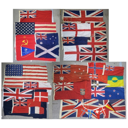 484 - A quantity of assorted maritime flags, to include various British Ensigns, one being mounted on a sh... 