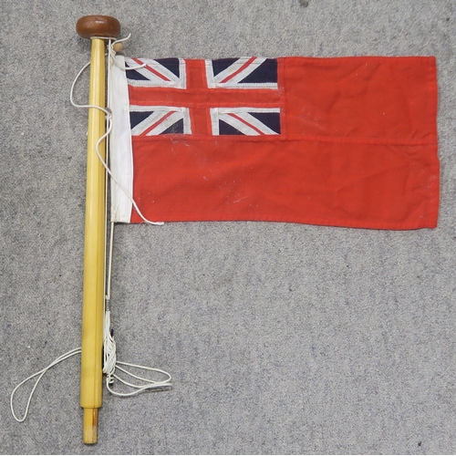 484 - A quantity of assorted maritime flags, to include various British Ensigns, one being mounted on a sh... 