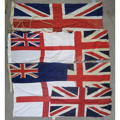 484 - A quantity of assorted maritime flags, to include various British Ensigns, one being mounted on a sh... 