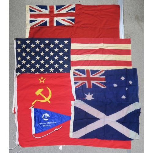 484 - A quantity of assorted maritime flags, to include various British Ensigns, one being mounted on a sh... 