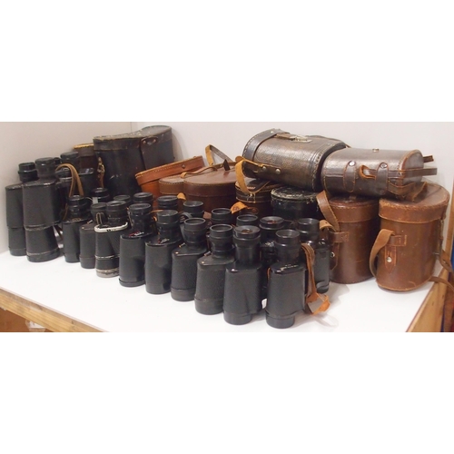 489 - A quantity of leather-cased vintage binoculars, with manufacturers to include Barr & Stroud, Can... 