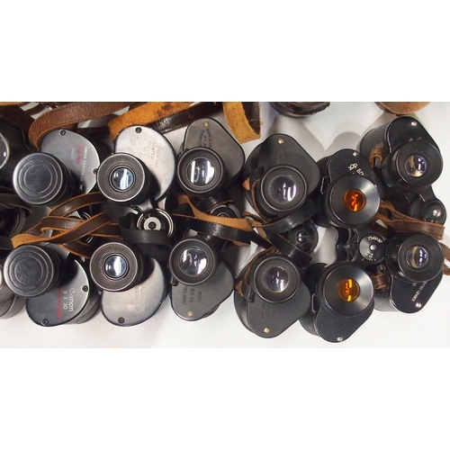 489 - A quantity of leather-cased vintage binoculars, with manufacturers to include Barr & Stroud, Can... 