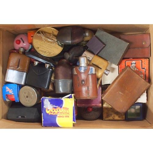 519 - A large mixed lot, comprising money banks, boxed safety razors, cigarette lighters, hipflasks etc.