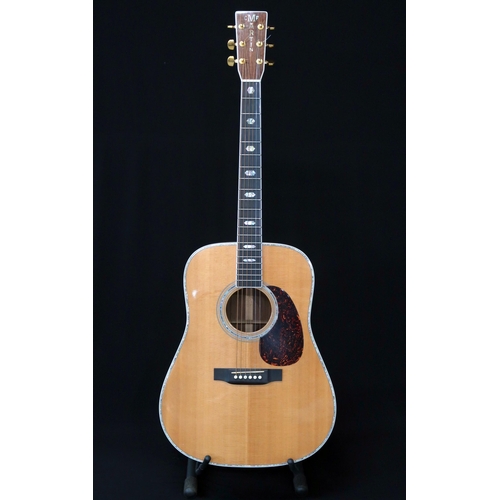 A Martin D-41 dreadnought 6 string acoustic guitar serial number 1012136 made in 2004 with a Martin fitted guitar case.