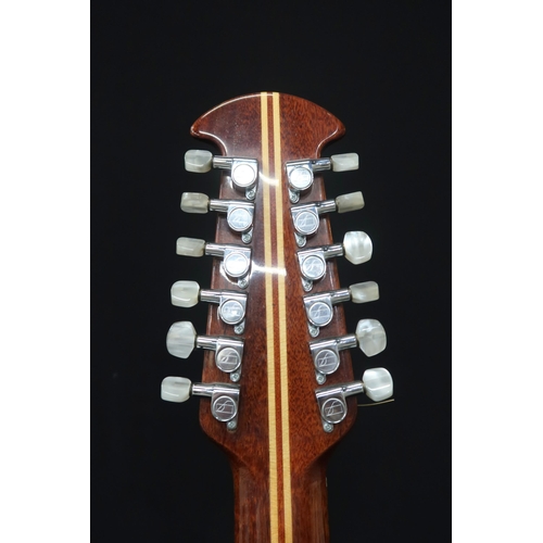 353 - An Ovation 12 string acoustic guitar, model 1155, serial number 307217 this 20 fret guitar come... 