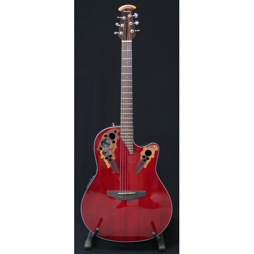 357 - An Ovation Celebrity electro acoustic six string guitar model CE44-RR in red, serial number CCV16022... 