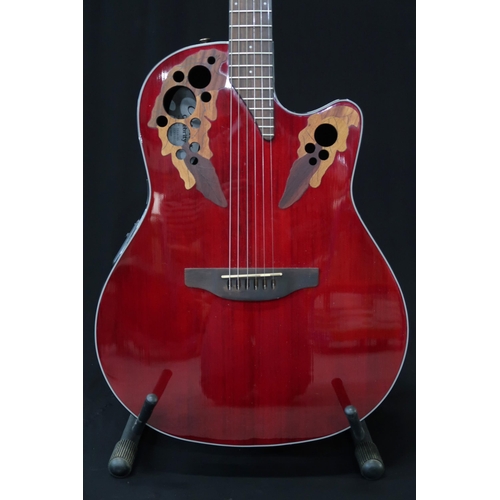 357 - An Ovation Celebrity electro acoustic six string guitar model CE44-RR in red, serial number CCV16022... 