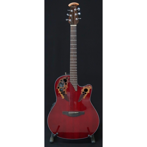 357 - An Ovation Celebrity electro acoustic six string guitar model CE44-RR in red, serial number CCV16022... 