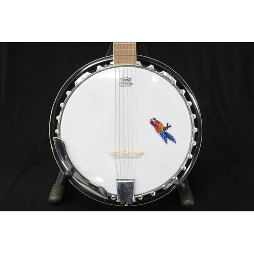 361 - An Ozark six string guitar banjo, 19 frets, with a fitted case and strap