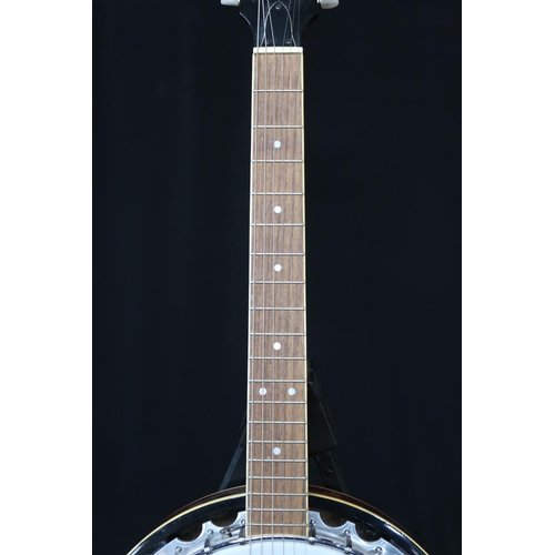 361 - An Ozark six string guitar banjo, 19 frets, with a fitted case and strap