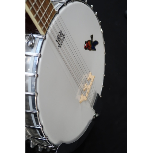 361 - An Ozark six string guitar banjo, 19 frets, with a fitted case and strap