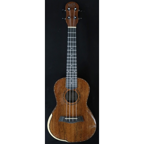 365 - A Barns & Mullins ukulele model BMUK5C with a fitted banjo case