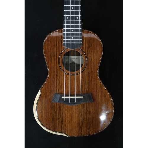 365 - A Barns & Mullins ukulele model BMUK5C with a fitted banjo case