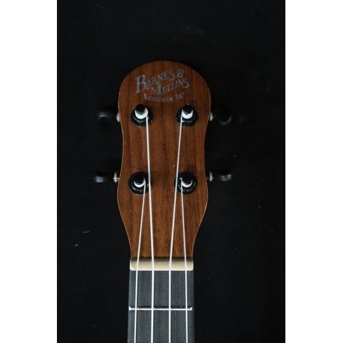 365 - A Barns & Mullins ukulele model BMUK5C with a fitted banjo case