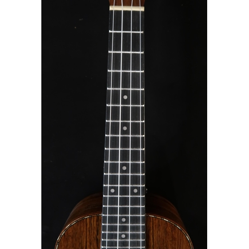 365 - A Barns & Mullins ukulele model BMUK5C with a fitted banjo case