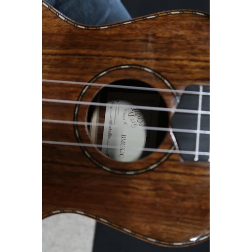 365 - A Barns & Mullins ukulele model BMUK5C with a fitted banjo case