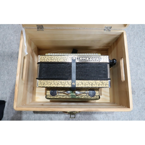 368 - A Hohner 4 stop 10 button melodeon the four voice 14 bellows melodeon comes together with a wooden c... 