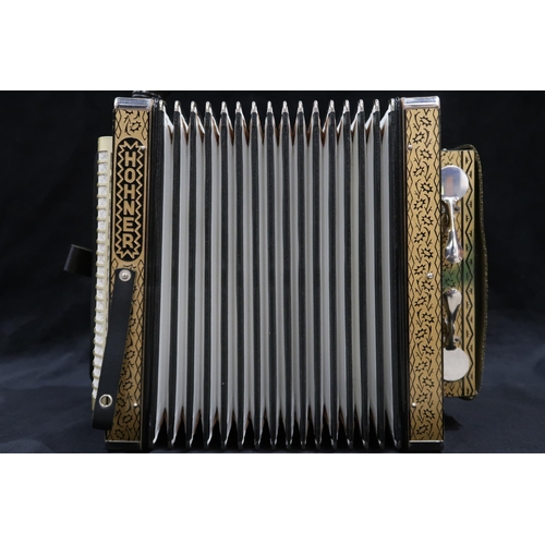 368 - A Hohner 4 stop 10 button melodeon the four voice 14 bellows melodeon comes together with a wooden c... 