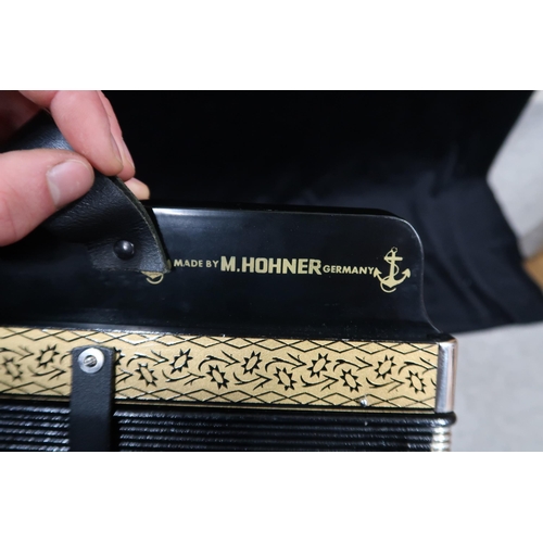 368 - A Hohner 4 stop 10 button melodeon the four voice 14 bellows melodeon comes together with a wooden c... 