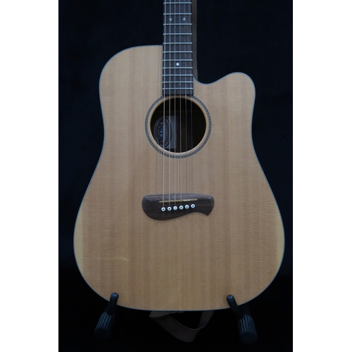 383 - A Tacoma six string acoustic guitar with faux tortoise shell trim model DM AC serial number H3070030... 