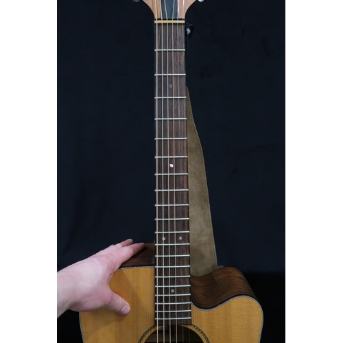 383 - A Tacoma six string acoustic guitar with faux tortoise shell trim model DM AC serial number H3070030... 