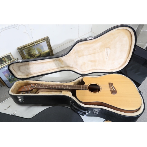 383 - A Tacoma six string acoustic guitar with faux tortoise shell trim model DM AC serial number H3070030... 