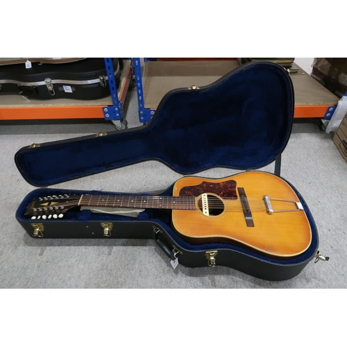 386 - GIBSON A vintage 1960's Gibson B-45 12 string acoustic guitar with natural finish and  tortoise shel... 